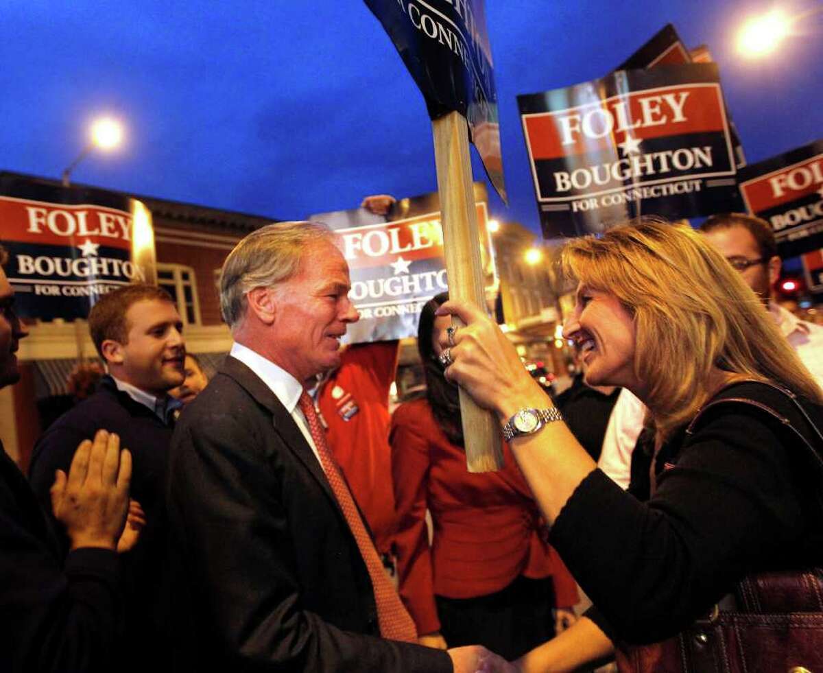 Connecticut Republican gubernatorial candidate Tom Foley greets supporters outside the Warner Theater in downtown Torrington, Conn. before a debate against Democratic candidate Dan Malloy on Monday, Oct. 25, 2010. (AP Photo/Christopher Massa, Pool)