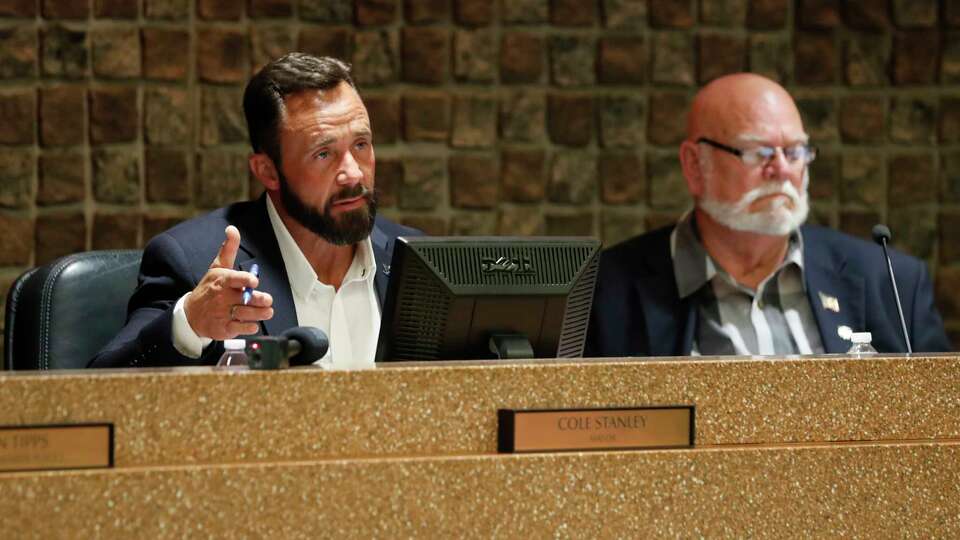 Amarillo Mayor Cole Stanley, left, and Councilman Tom Scherlen listen to testimony during a city council meeting Tuesday, May 28 in Amarillo. Residents gave testimony and arguments to members of the city council as they discussed a proposed abortion travel ban in Amarillo.