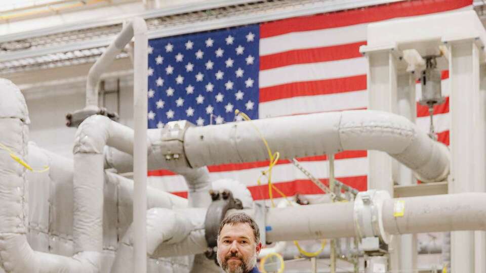 Jon Wade, managing engineer, posed for a portrait in front of the Supercritical Transformational Electric Power, or STEP, demonstration plant on the campus of the Southwest Research Institute on May 29, 2024, in San Antonio, Texas.