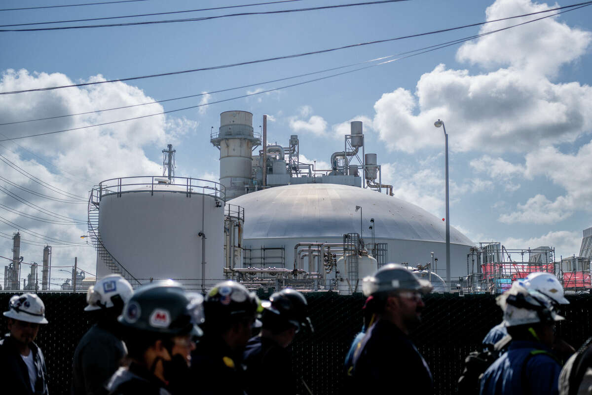 Workers exit the Marathon Galveston Bay Refinery on May 10, 2022 in Texas City, Texas. 