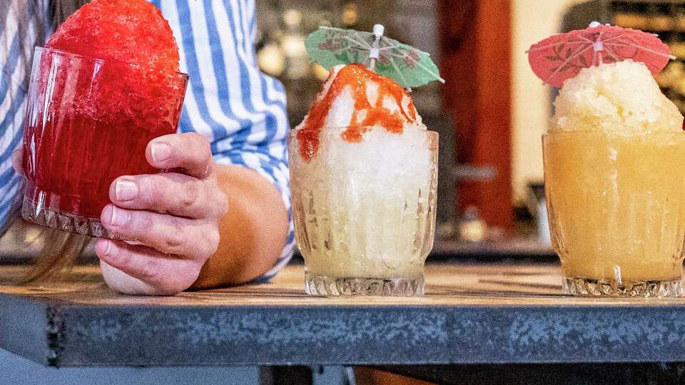 From left, tiger's blood, mangonada and Strocone boozy snoballs are visible Thursday, May 30, 2024 at East End Hardware on Leeland Street in Houston.