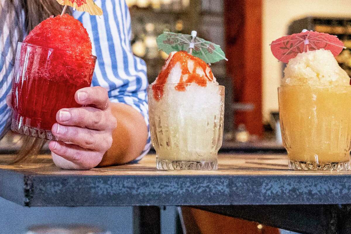 From left, tiger's blood, mangonada and Strocone boozy snoballs are visible Thursday, May 30, 2024 at East End Hardware on Leeland Street in Houston.