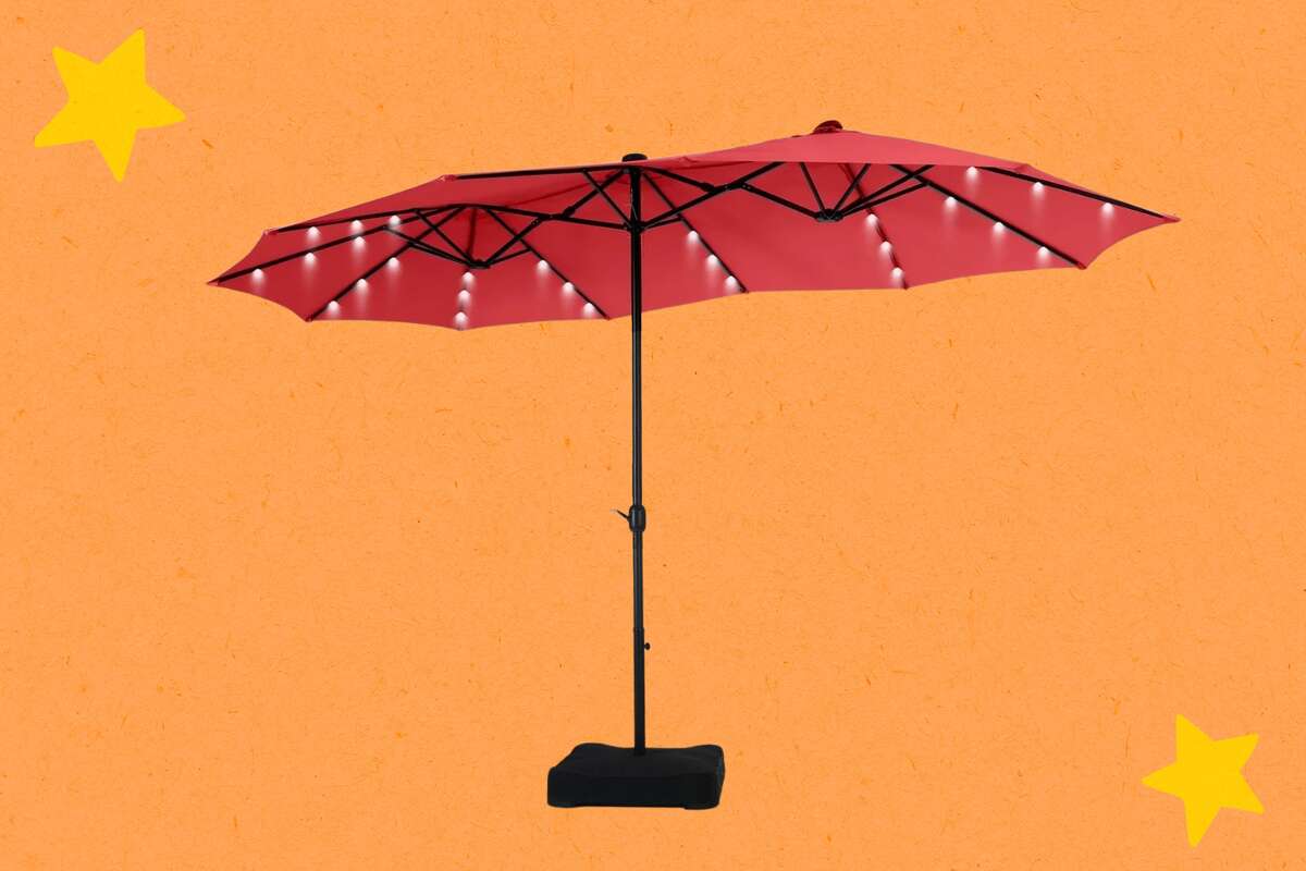 LEDs along each rib charge during the day, thanks to solar panels atop the umbrella.