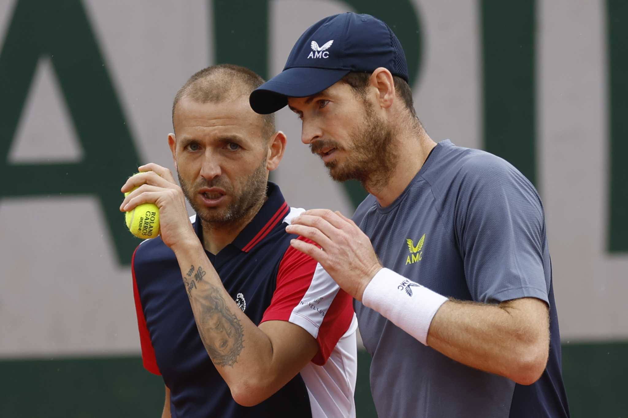 Andy Murray and Dan Evans lose in the first round of doubles at the