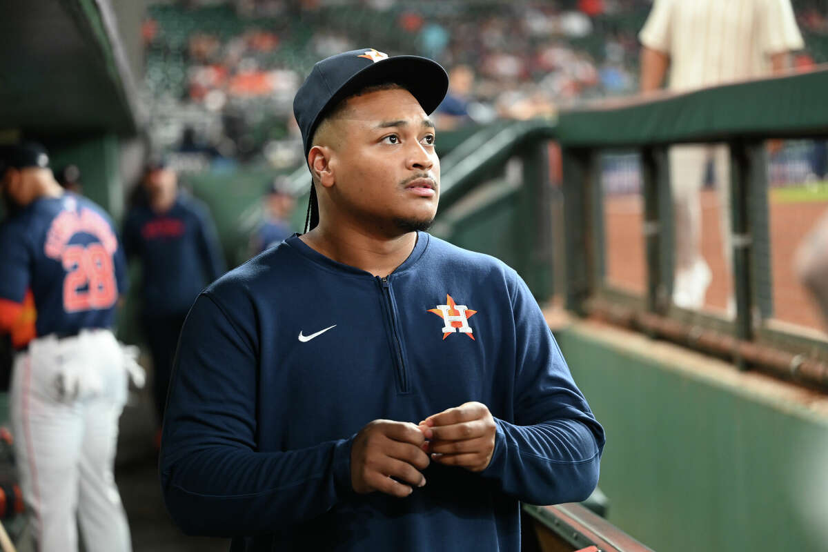 Luis Garcia #77 of the Houston Astros stands in the dugout before the game against the Seattle Mariners at Minute Maid Park on May 04, 2024 in Houston, Texas. 