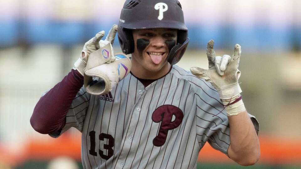 Pearland's Cade Adams (13) reacts toward the dugout hitting a single in the second inning of Game 3 during a Region III-6A championship series at Constellation Field, Saturday, June 1, 2024, in Houston.