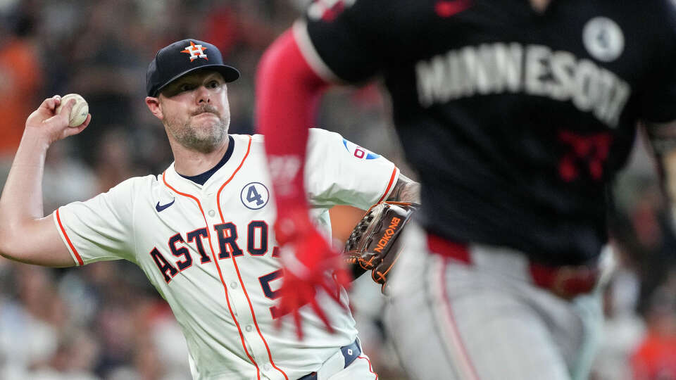 Houston Astros relief pitcher Ryan Pressly (55) throws to first baseman first baseman José Abreu (79) to get out Minnesota Twins outfielder Max Kepler (26) during the eighth inning of an MLB game Sunday, June 2, 2024, at Minute Maid Park in Houston.