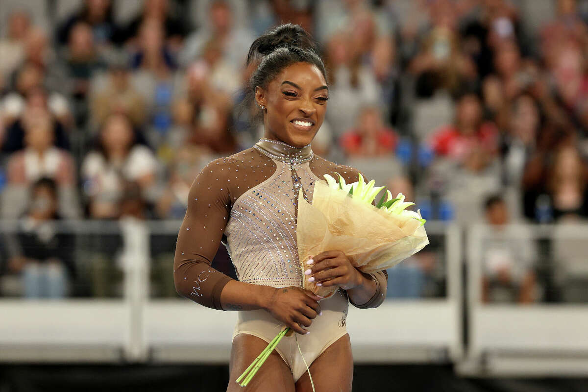 First place all around winner Simone Biles celebrates after the 2024 Xfinity U.S. Gymnastics Championships at Dickies Arena on June 02, 2024 in Fort Worth, Texas. (Photo by Elsa/Getty Images)