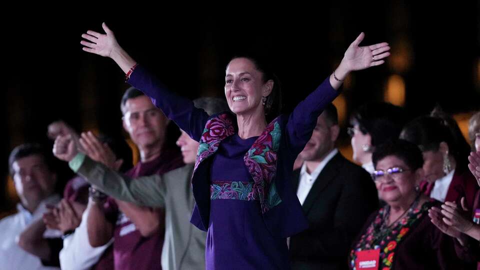 President-elect Claudia Sheinbaum waves to supporters at the Zocalo, Mexico City's main square, after the National Electoral Institute announced she held an irreversible lead in the election, early Monday, June 3, 2024.