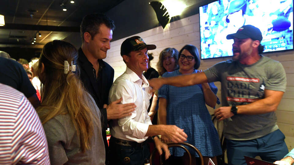 Speaker of the House and presumptive run-off winner in the District 21 Representative race Dade Phelan is celebrated by supporters at his election party at JW's Patio. Photo made Tuesday, May 28, 2024 Kim Brent/Beaumont Enterprise