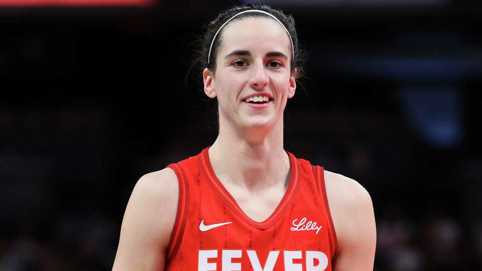 INDIANAPOLIS, INDIANA - JUNE 01: Caitlin Clark #22 of the Indiana Fever smiles against the Chicago Sky during the third quarter in the game at Gainbridge Fieldhouse on June 01, 2024 in Indianapolis, Indiana. NOTE TO USER: User expressly acknowledges and agrees that, by downloading and or using this photograph, User is consenting to the terms and conditions of the Getty Images License Agreement.