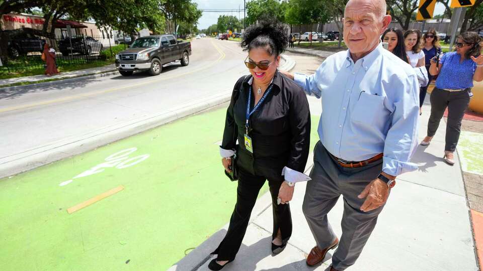 Mayor John Whitmire walks with Tammy Rodriguez as they take a tour of High Star Street, where a bicycle lane is being built, leaving no room for bus traffic in the area, on Monday, June 3, 2024 in Houston.