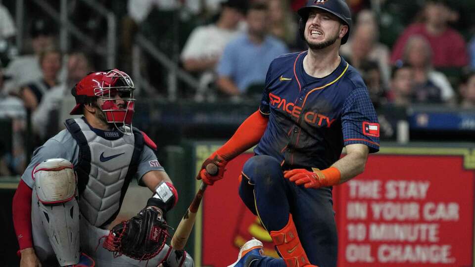 Houston Astros right fielder Kyle Tucker (30) crumples after fouling a ball off himself during the third inning of an MLB game Monday, June 3, 2024, at Minute Maid Park in Houston.