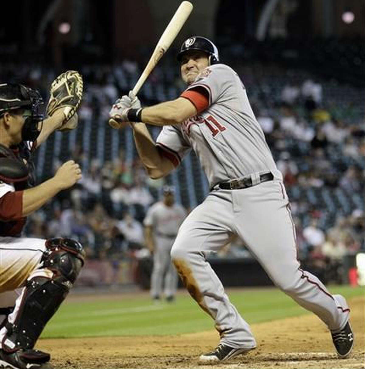 Washington Nationals baseball player Adam Dunn poses with his wife