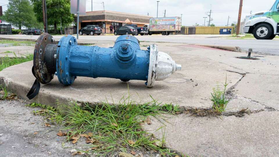 A broken fire hydrant and cracked and uneven sidewalk cement make it difficult o walk along Telephone Road near Marlin Road Tuesday, June 4, 2024 in the Houston Second Ward.