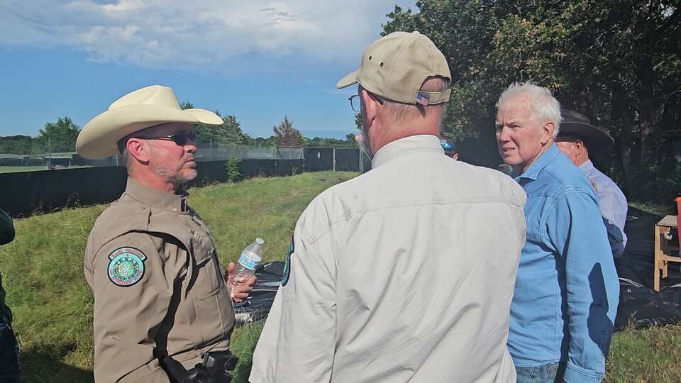 Game warden David Murray, TPWD big game program director Alan Cain and RW Trophy Ranch owner Robert Williams on May 28.