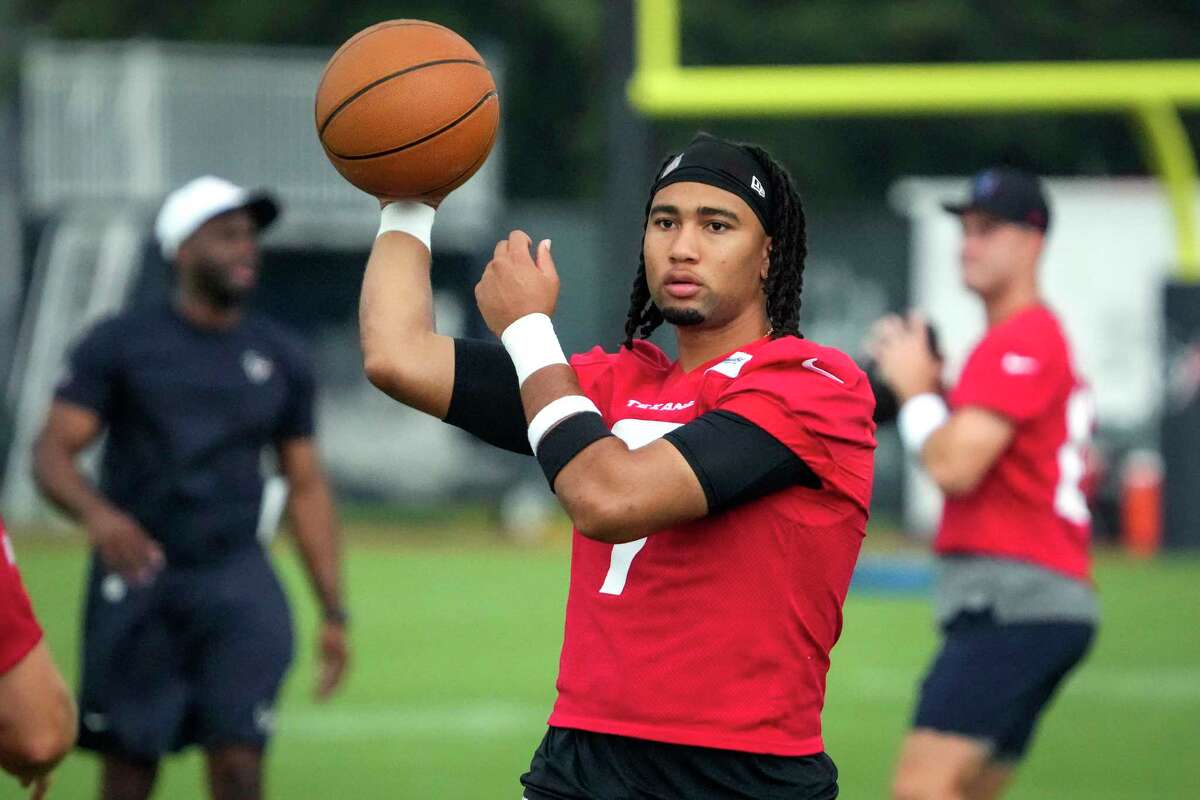 Houston Texans quarterback C.J. Stroud warms up throwing a basketball during an NFL mandatory mini camp practice Wednesday, June 5, 2024, at Houston Methodist Training Center in Houston.