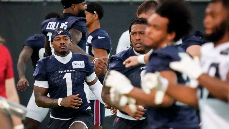 Houston Texans Stefon Diggs (1) warms up during an NFL mandatory mini camp practice Wednesday, June 5, 2024, at Houston Methodist Training Center in Houston.