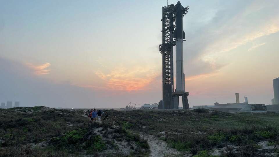 The SpaceX Super Heavy rocket and Starship spacecraft stand in the evening light on June 5, 2024. It took its fourth flight on June 6, 2024, from Boca Chica.