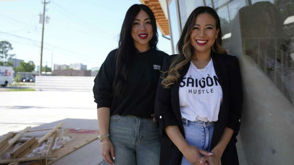 Cassie Ghaffar and Sandy Nguyen, two best friends that launched a popular drive-through Vietnamese restaurant in Garden Oaks called Saigon Hustle, are photographed at the construction site of their second location on Thursday, June 6, 2024, in Houston. Plans are to convert a former retro gas station into a 2,000 square foot drive-through restaurant.