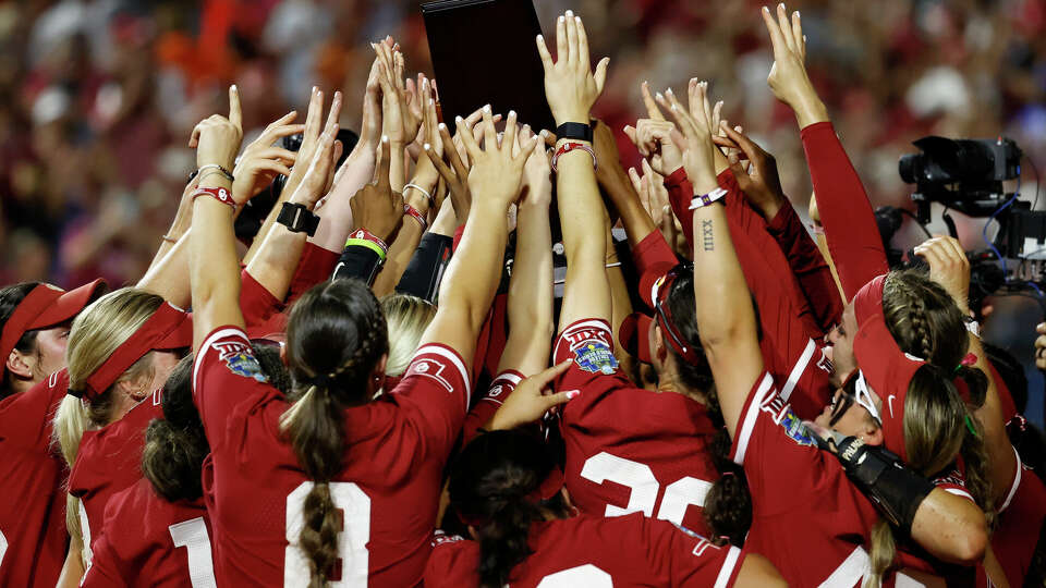 The Oklahoma Sooners lift the national championship trophy following their 8-4 win over the Texas Longhorns during game two of the Division I Softball Championship held at Devon Park on June 6, 2024 in Oklahoma City, Oklahoma. (Photo by Brendall O'Banon/NCAA Photos via Getty Images)