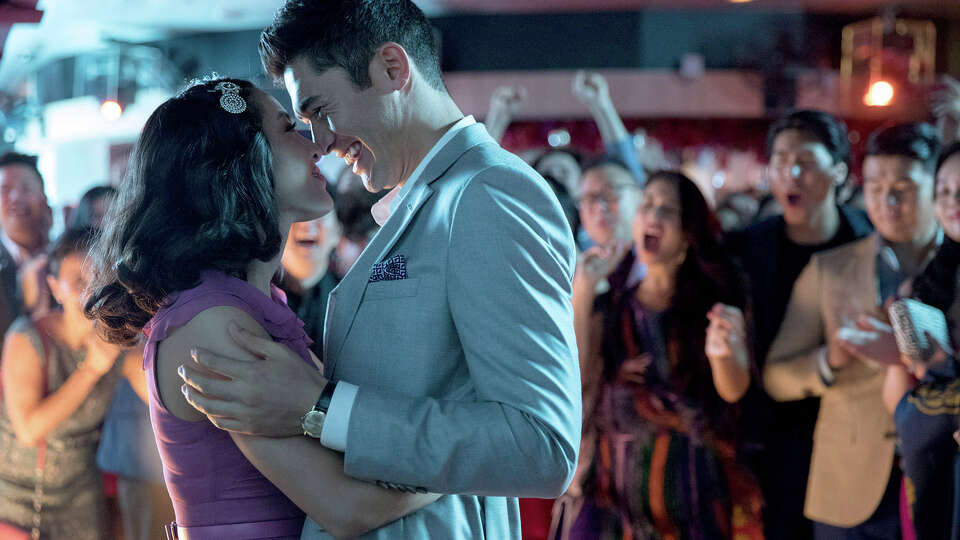 Constance Wu as Rachel and Henry Golding as Nick in 'Crazy Rich Asians.' MUST CREDIT: Sanja Bucko, Warner Bros. Pictures