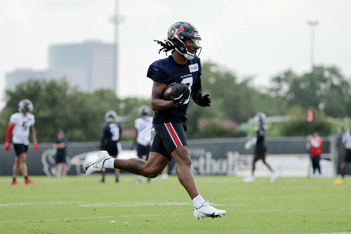 John Metchie III #8 of the Houston Texans catches a pass during Mandatory Minicamp at Houston Methodist Training Center on June 04, 2024 in Houston, Texas.