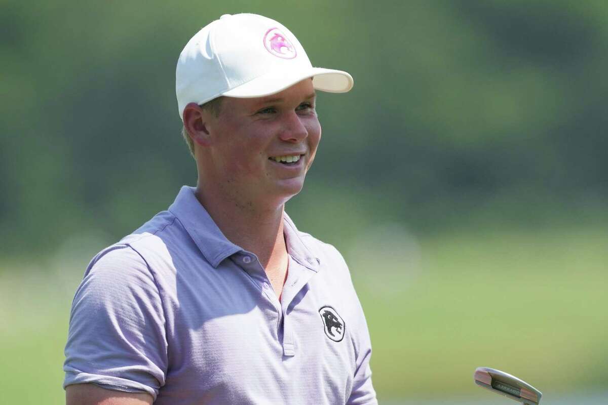 Caleb Surratt smiles after hitting a par on the 18th hole during the LIV Golf Houston tournament at Golf Club of Houston on Friday, June 7, 2024 in Humble. Surratt ended the day at 7 below par.