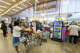 Customers line up at the checkout aisles at Grocery Outlet in Oakland, Calif., on June 7, 2024.
