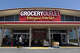 A customer walks in front of the Grocery Outlet in Oakland, Calif., on June 7, 2024.