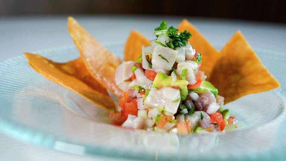 Yellowtail ceviche with a Serrano pico de gallo, passion fruit, avocado & tortilla chips is shown at MF Seafood on Friday, June 7, 2024 in Houston.