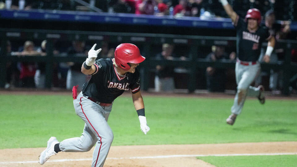 Tomball's Blaine Lucas (14) reacts after hitting a bases-loaded, two-run single to take a 2-0 lead in the sixth inning of a Class 6A state semifinal high school game during the UIL State Baseball Championships at Dell Dimond, Friday, June 7, 2024, in Round Rock.