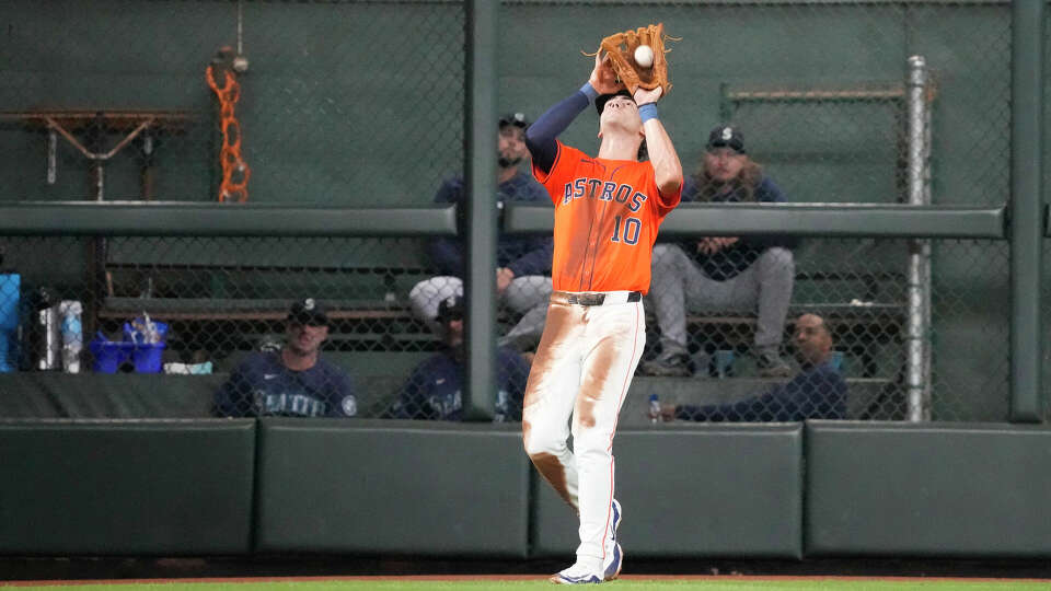 Houston Astros left fielder Joey Loperfido (10) catches Seattle Mariners Mitch Haniger's fly out during the sixth inning of an MLB game at Minute Maid Park on Friday, May 3, 2024, in Houston.