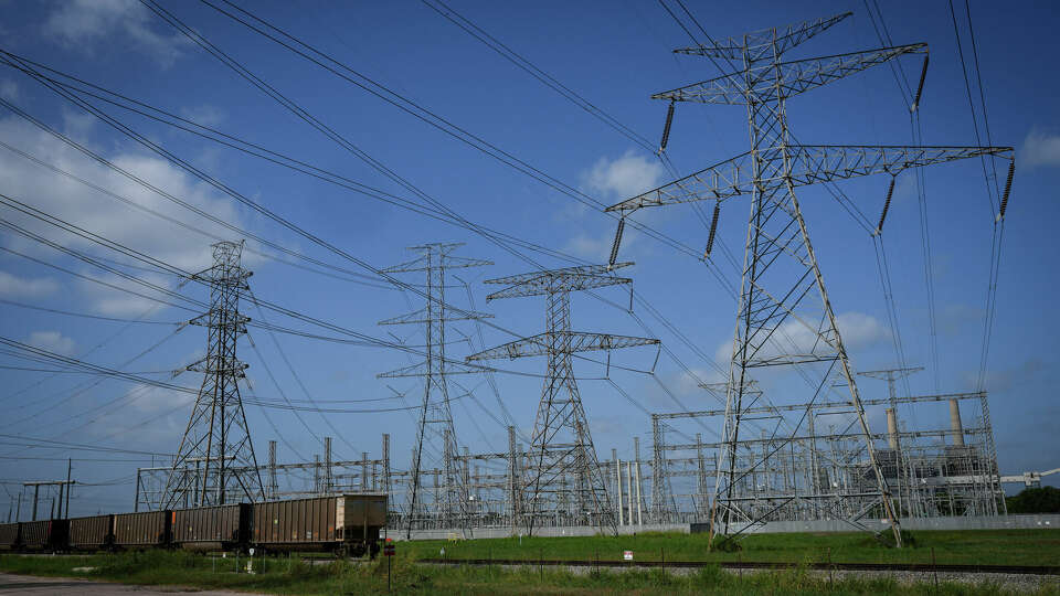 Transmission lines at the WA Parish Generating Station on July 19, 2023 in Richmond. The Electric Reliability Council of Texas said there is risk of controlled outages this August on nights when there is low wind power production. 