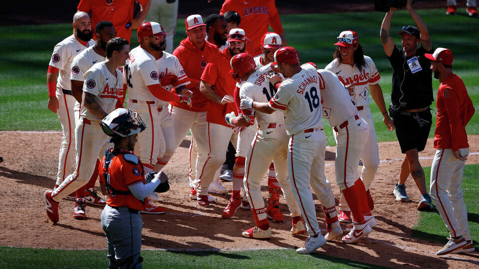 Logan O'Hoppe #14 of the Los Angeles Angels after hitting a walk off home run against the Houston Astros in the ninth inning at Angel Stadium of Anaheim on June 09, 2024 in Anaheim, California. (Photo by Ronald Martinez/Getty Images)