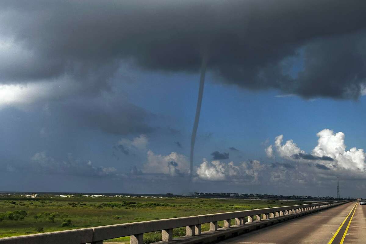 Joshua Nørregaard spotted the giant waterspout near San Luis Pass Bridge on Monday morning. 