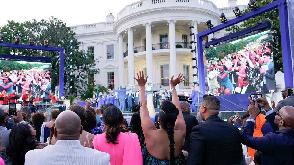 FILE - Guests respond as Broadway Inspirational Voices performs during a Juneteenth concert on the South Lawn of the White House in Washington, June 13, 2023. Biden will celebrate the Juneteenth holiday early with a concert on the White House South Lawn on Monday night. Singers Gladys Knight and Patti LaBelle will be among the performers. Biden signed a law in 2021 that made June 19, or Juneteenth, a federal holiday.