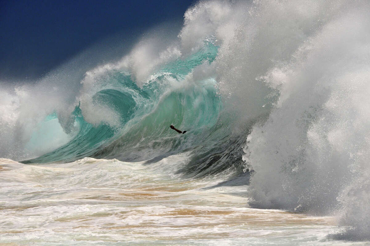 FILE - Giant swell at Sandy's beach on the island of Oahu.