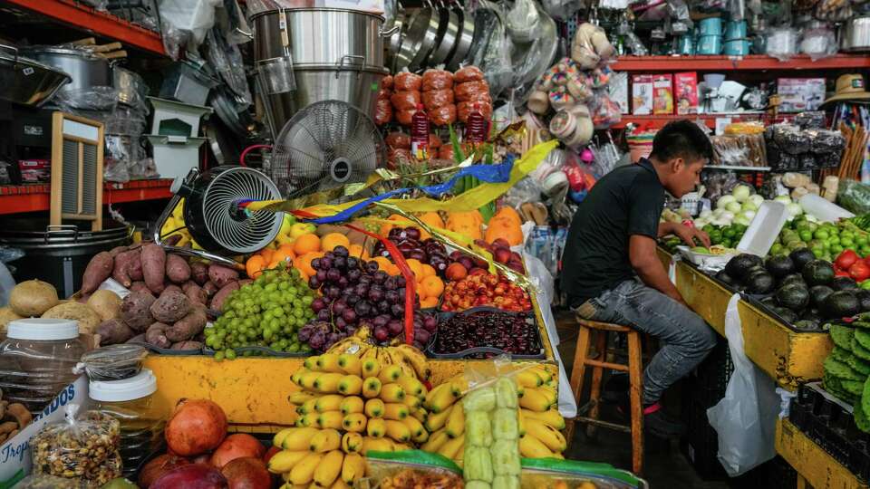 A vendor eats at the Houston Farmers Market on Tuesday, June 11, 2024, in Houston. There was recently a shooting at the Houston Farmers Market that left a security guard dead on June 6.