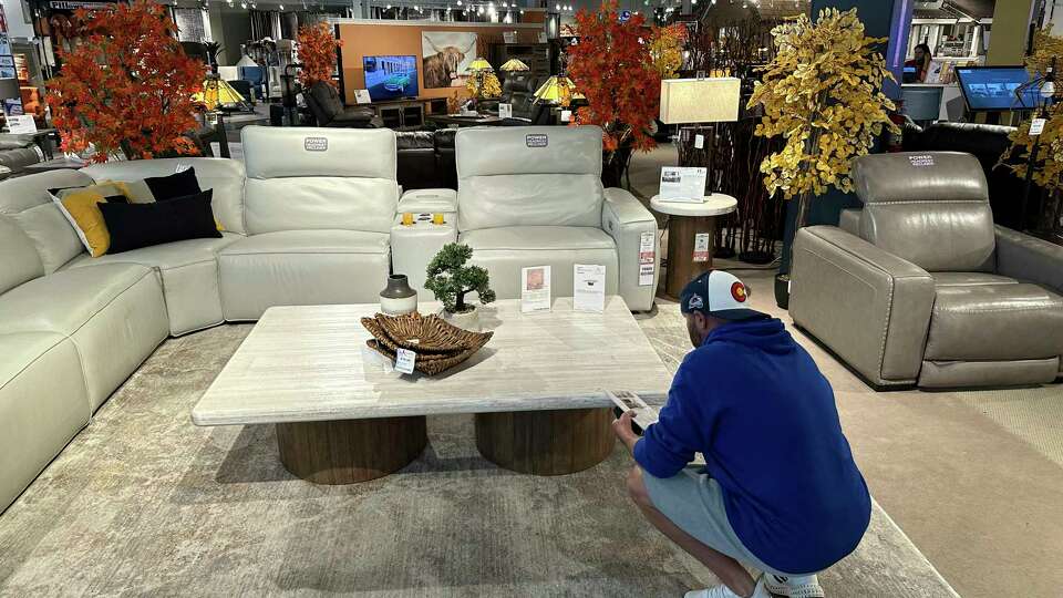 A shopper pauses at a display in a furniture store Sunday, June 2, 2024, in Englewood, Colo. On Wednesday, June 12, 2024, the Labor Department issues its report on prices at the consumer level in May.