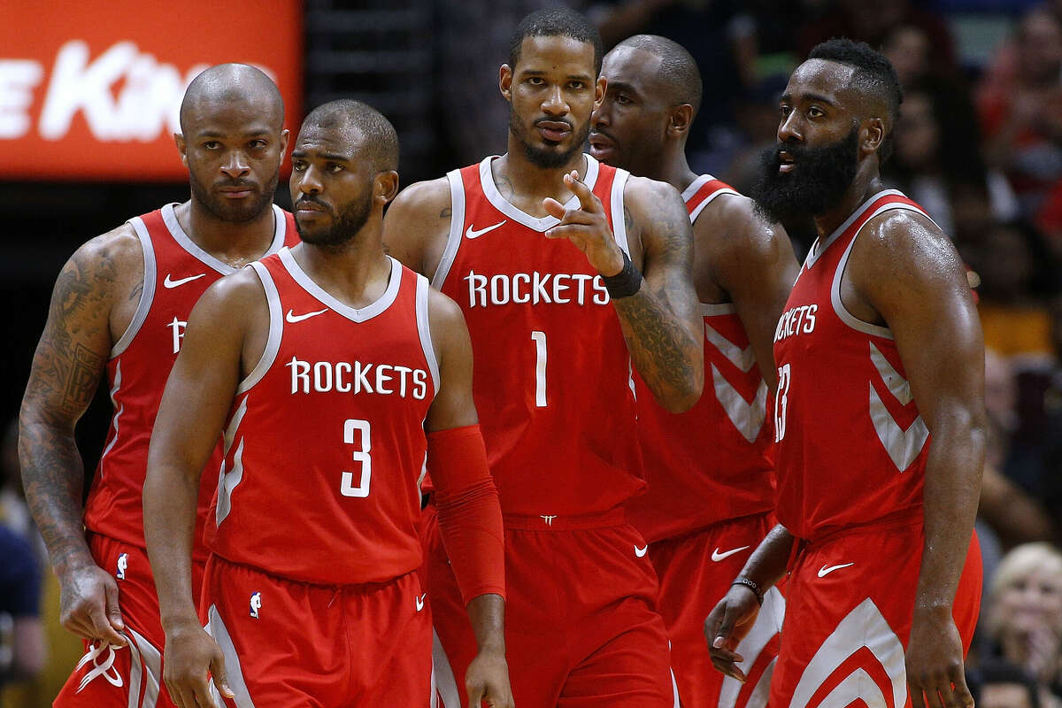 Chris Paul #3 of the Houston Rockets, James Harden #13, Trevor Ariza #1, Luc Mbah a Moute #12 and PJ Tucker #4 talk during the second half against the New Orleans Pelicans at the Smoothie King Center on March 17, 2018 in New Orleans, Louisiana. 