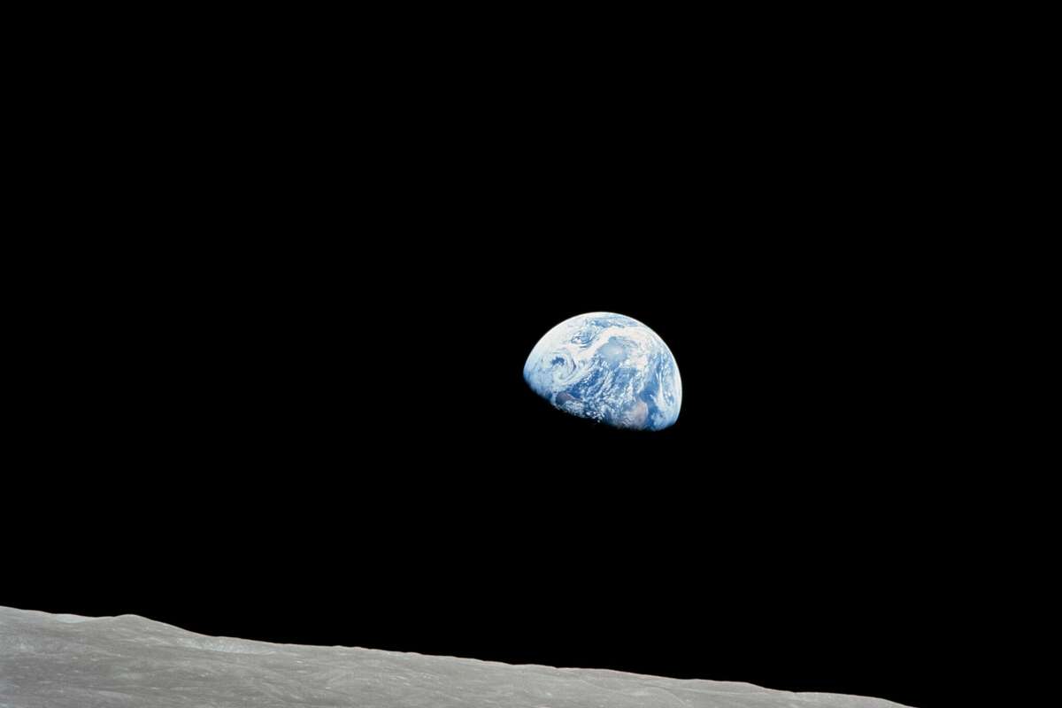 Taken aboard Apollo 8 by Bill Anders, this iconic picture shows Earth peeking out from beyond the lunar surface as the first crewed spacecraft circumnavigated the Moon.