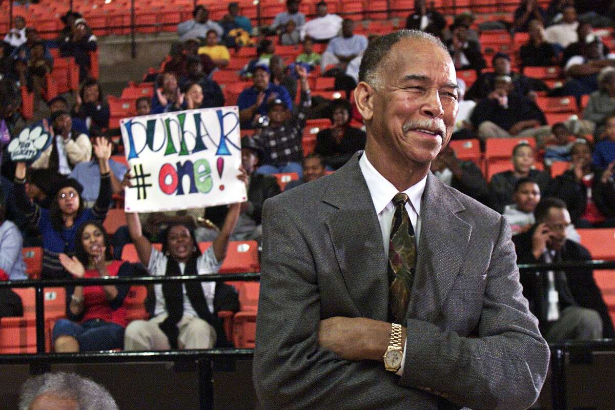 Fort Worth Dunbar coach Robert Hughes gets cheers from the crowd as he is honored before a game against Fort Worth North Side in Fort Worth, Texas, Friday, Feb. 7, 2003. Hughes tied teh retired Morgan Wootten for the boys high school national record of 1,274 victories. (AP Photo/Fort Worth Star-Telelgram, Alison Woodworth)