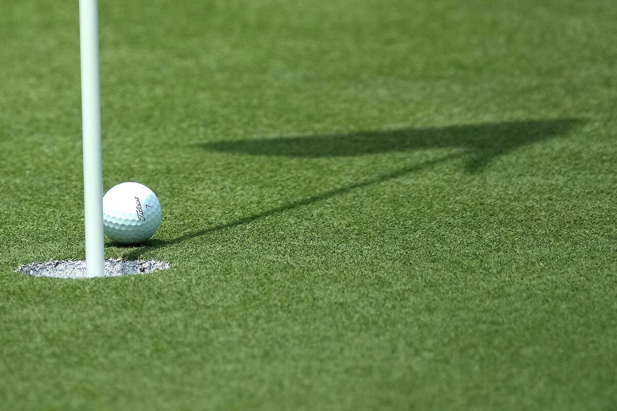 A golf ball just misses the 18th hole at Carlton Woods on Thursday, April 18, 2024 in The Woodlands.