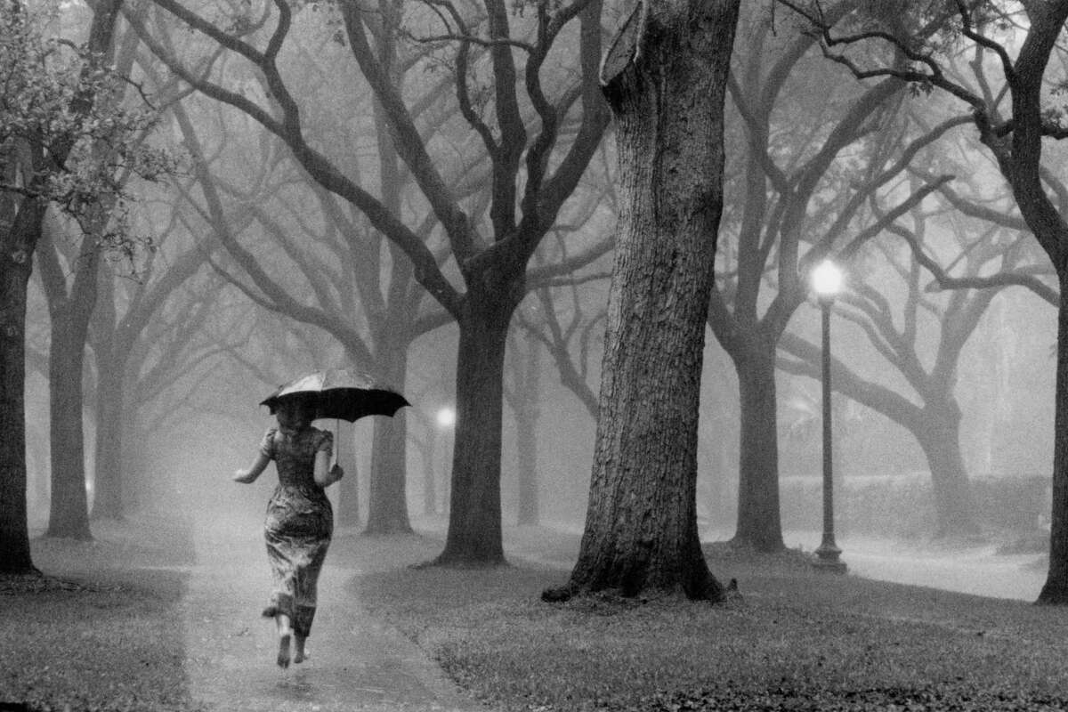 Woman caught in afternoon thunderstorn near Rice University, Aprill 1979.