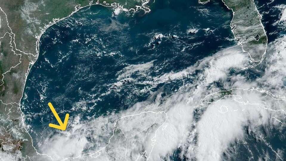 National Hurricane Center forecasters are watching the Bay of Campeche in the Gulf of Mexico, identified here by the yellow arrow, where a cluster of clouds in an area of unstable air has a 50% chance of becoming a tropical cyclone.