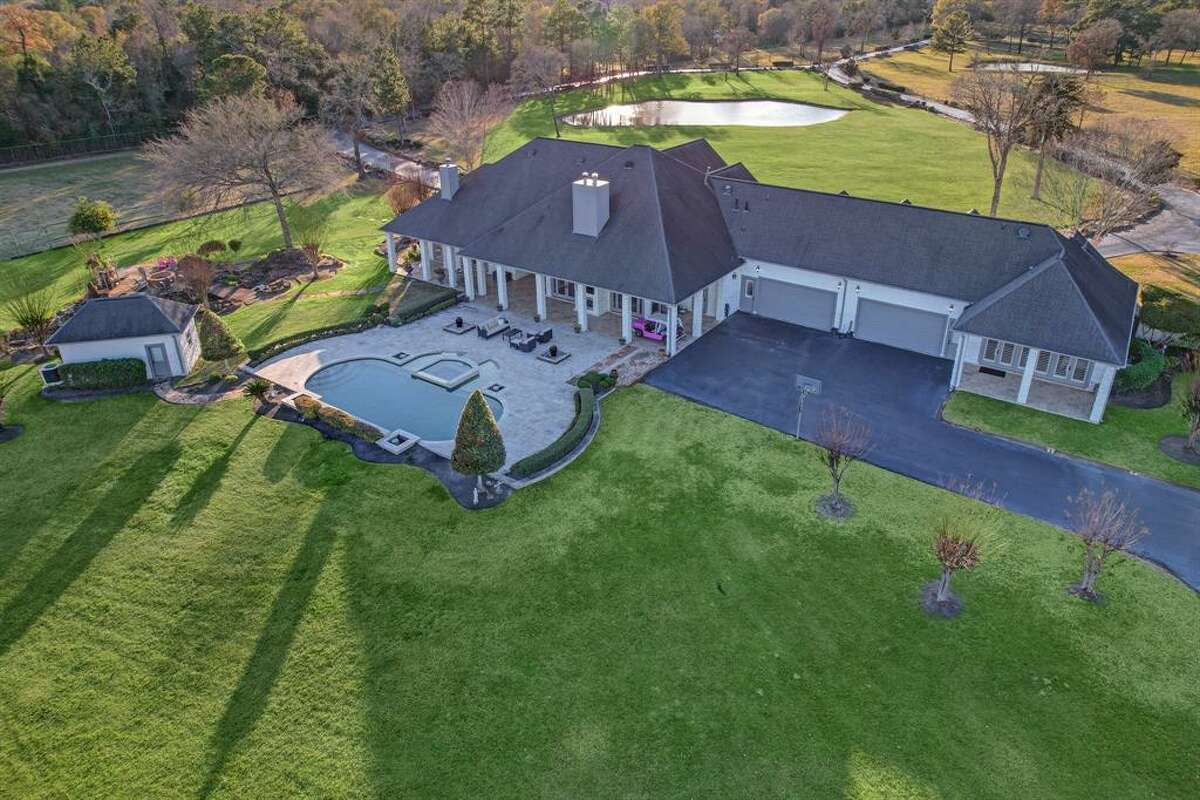 For nearly $8 million, a 73-acre home at Luxury Estate Ranch in Montgomery offers close proximity to acclaimed golf courses, a 8.5-acre lake with a fishing pier, two separate homes with full kitchens, entertainment space with a custom cedar bar and two full-size RVs. 