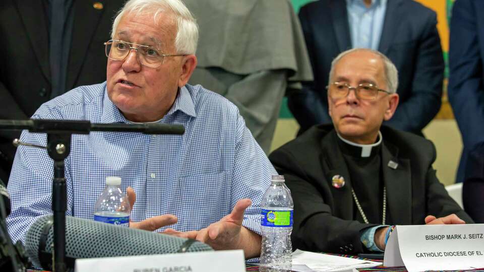 FILE - Ruben Garcia, founder and director of Annunciation House, a network of migrants shelters in El Paso, Texas, speaks during a news conference accompanied by Bishop Mark Seitz, Friday, Feb. 23, 2024. Government officials would be infringing on religious freedom if they were to restrict the Catholic Church's work serving migrants along the U.S.-Mexico border, says a top U.S. bishop.