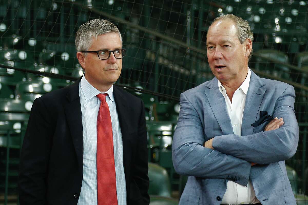 HOUSTON, TX - JUNE 30: Houston Astros owner Jim Crane, right, and Houston general manager Jeff Luhnow chat during battting practice at Minute Maid Park on June 30, 2017 in Houston, Texas. (Photo by Bob Levey/Getty Images)