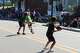 Glen Carbon parade-goers enjoy the summer weather while waiting for the 2024 Homecoming parade to begin. The summer o...